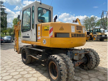 Колёсный экскаватор LIEBHERR