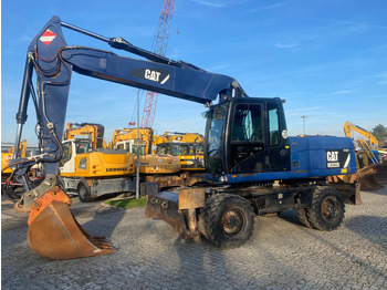 Колёсный экскаватор CATERPILLAR M322D