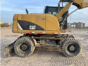 Колёсный экскаватор CATERPILLAR M315