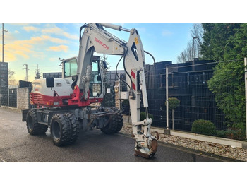 Колёсный экскаватор TAKEUCHI