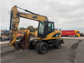 Колёсный экскаватор CATERPILLAR M313D