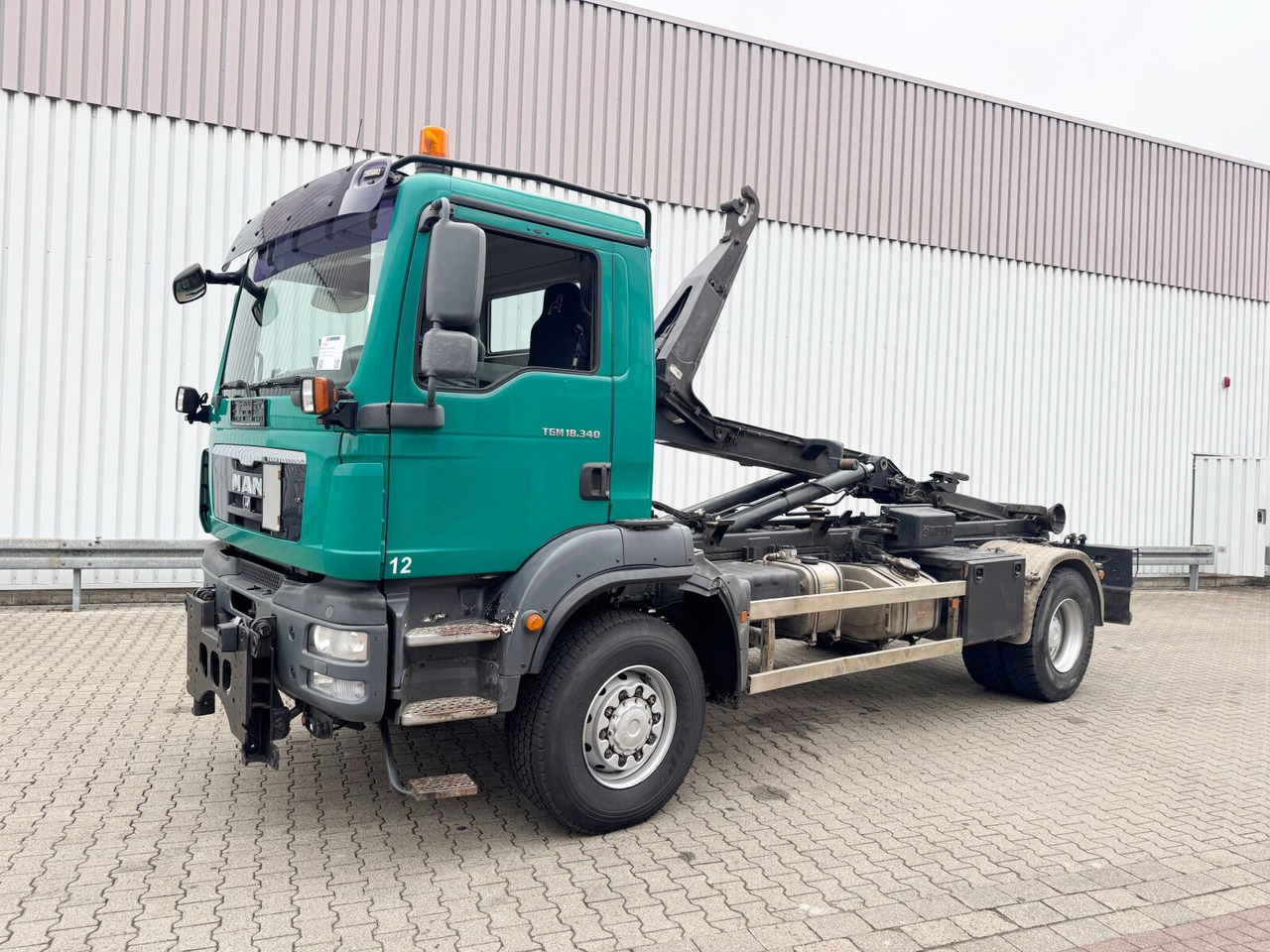 MAN TGM 18.340 4x4 BB TGM 18.340 4x4 BB, Hiab LHT 19046 Abrollkipper, Widi Platte - Крюковой мультилифт: фото 1 MAN TGM 18.340 4x4 BB TGM 18.340 4x4 BB, Hiab LHT 19046 Abrollkipper, Widi Platte - Крюковой мультилифт: фото 1