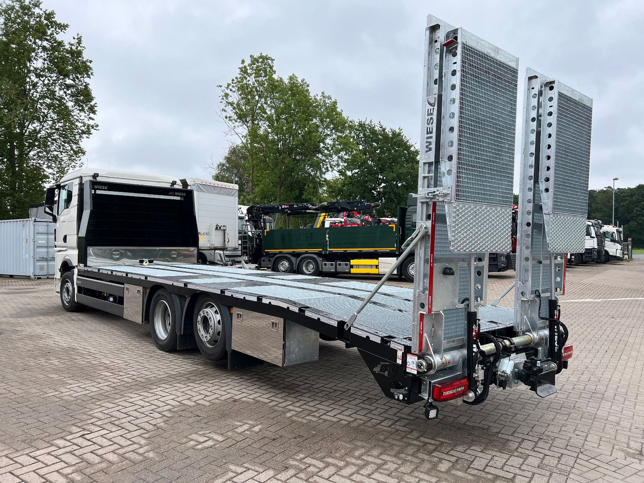 MAN Baumaschinen- Arbeitsbühnentransporter Rampen - Эвакуатор: фото 1 MAN Baumaschinen- Arbeitsbühnentransporter Rampen - Эвакуатор: фото 1