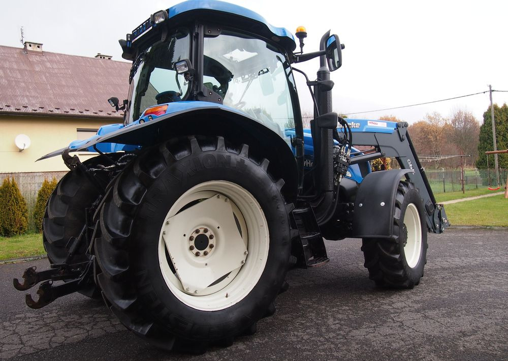Ciągnik New Holland NH TS125A 6 cylindrów 2004 Ciągnik rolniczy New Holland TS125A - Трактор: фото 4 Ciągnik New Holland NH TS125A 6 cylindrów 2004 Ciągnik rolniczy New Holland TS125A - Трактор: фото 4