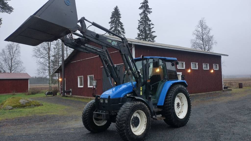 New Holland TL90 trima kuormaaja, sähköinen suunnanvaihtaja - Трактор: фото 1 New Holland TL90 trima kuormaaja, sähköinen suunnanvaihtaja - Трактор: фото 1
