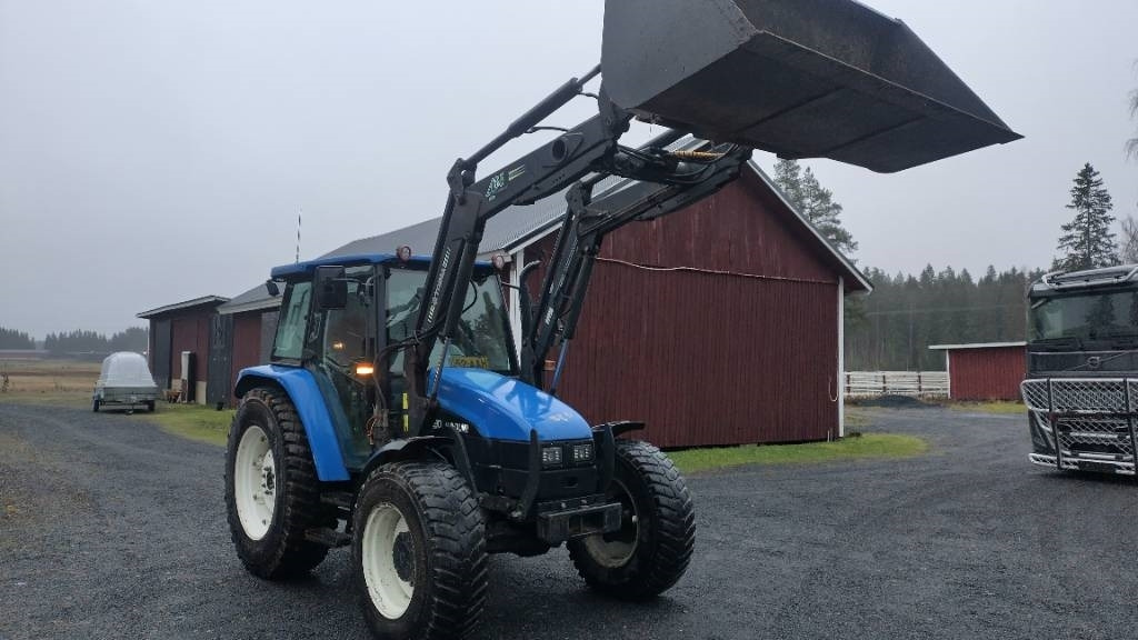 New Holland TL90 trima kuormaaja, sähköinen suunnanvaihtaja - Трактор: фото 2 New Holland TL90 trima kuormaaja, sähköinen suunnanvaihtaja - Трактор: фото 2