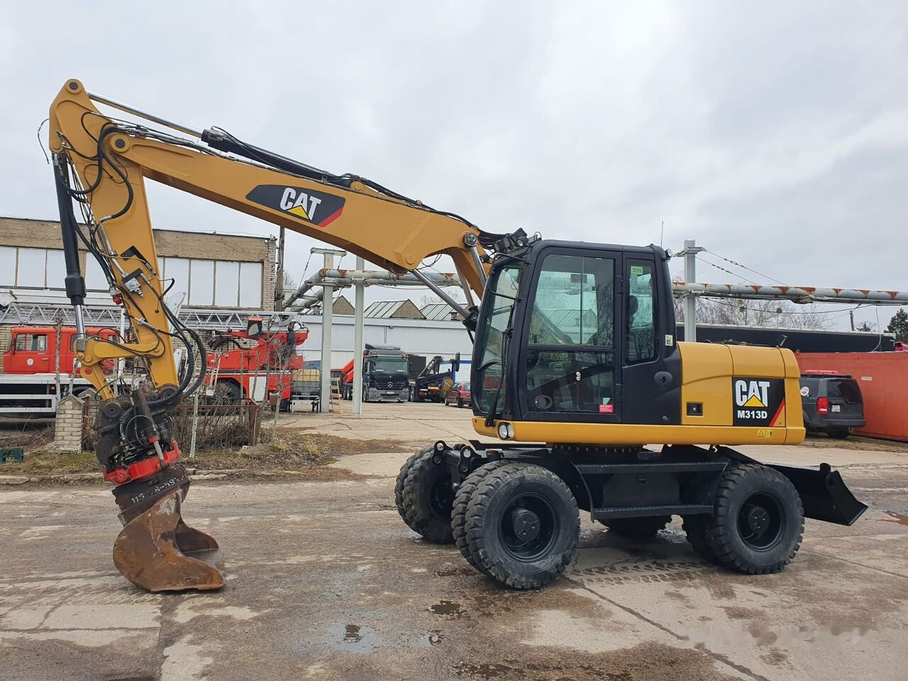 Caterpillar M 313 D Tiltrotator - Колёсный экскаватор: фото 2 Caterpillar M 313 D Tiltrotator - Колёсный экскаватор: фото 2