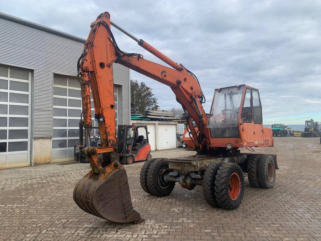 Atlas AB1302 / AB1500 mit Löffel und Greifer - Колёсный экскаватор: фото 1 Atlas AB1302 / AB1500 mit Löffel und Greifer - Колёсный экскаватор: фото 1