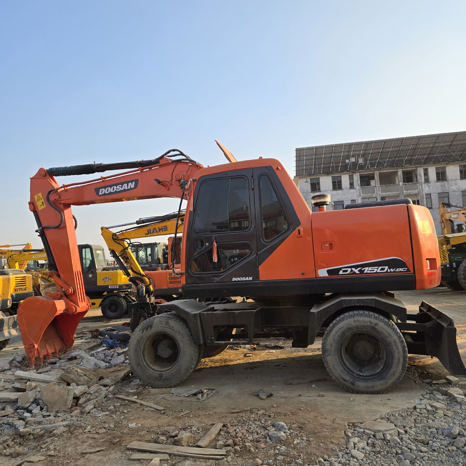 Doosan DX150W-9C - Колёсный экскаватор: фото 1 Doosan DX150W-9C - Колёсный экскаватор: фото 1