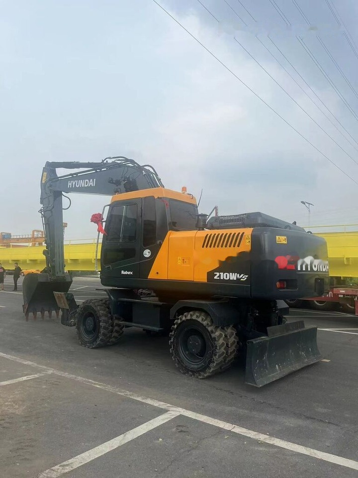 Hyundai 210W-9 - Колёсный экскаватор: фото 1 Hyundai 210W-9 - Колёсный экскаватор: фото 1