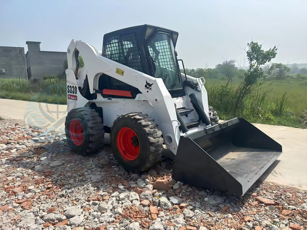 BOBCAT 330 - Мини-погрузчик с бортовым поворотом: фото 3 BOBCAT 330 - Мини-погрузчик с бортовым поворотом: фото 3